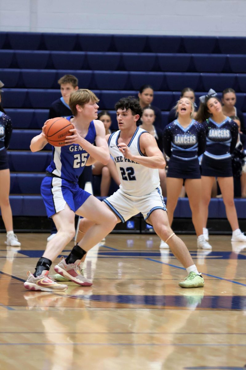Dennasion LaGioia (LP 24) defends in a recent competition for the boys basketball team.