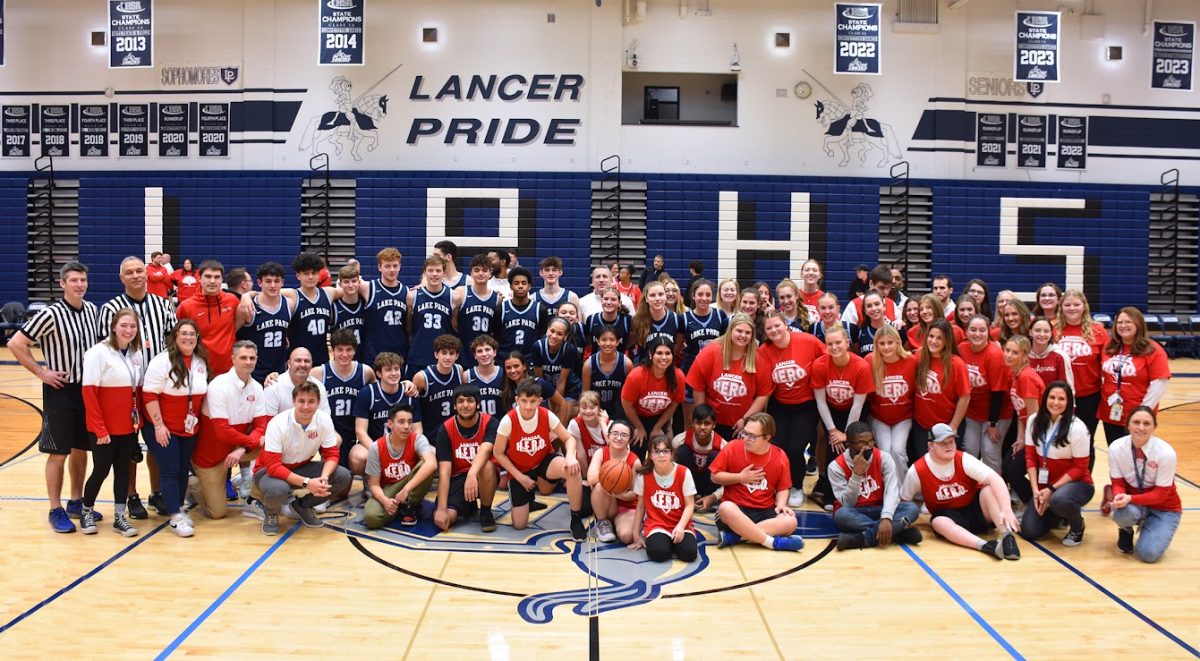 The participants, sponsors, referees, and members of Lancer HERO posing after their annual basketball contest, held to raise money for The Special Olympics.