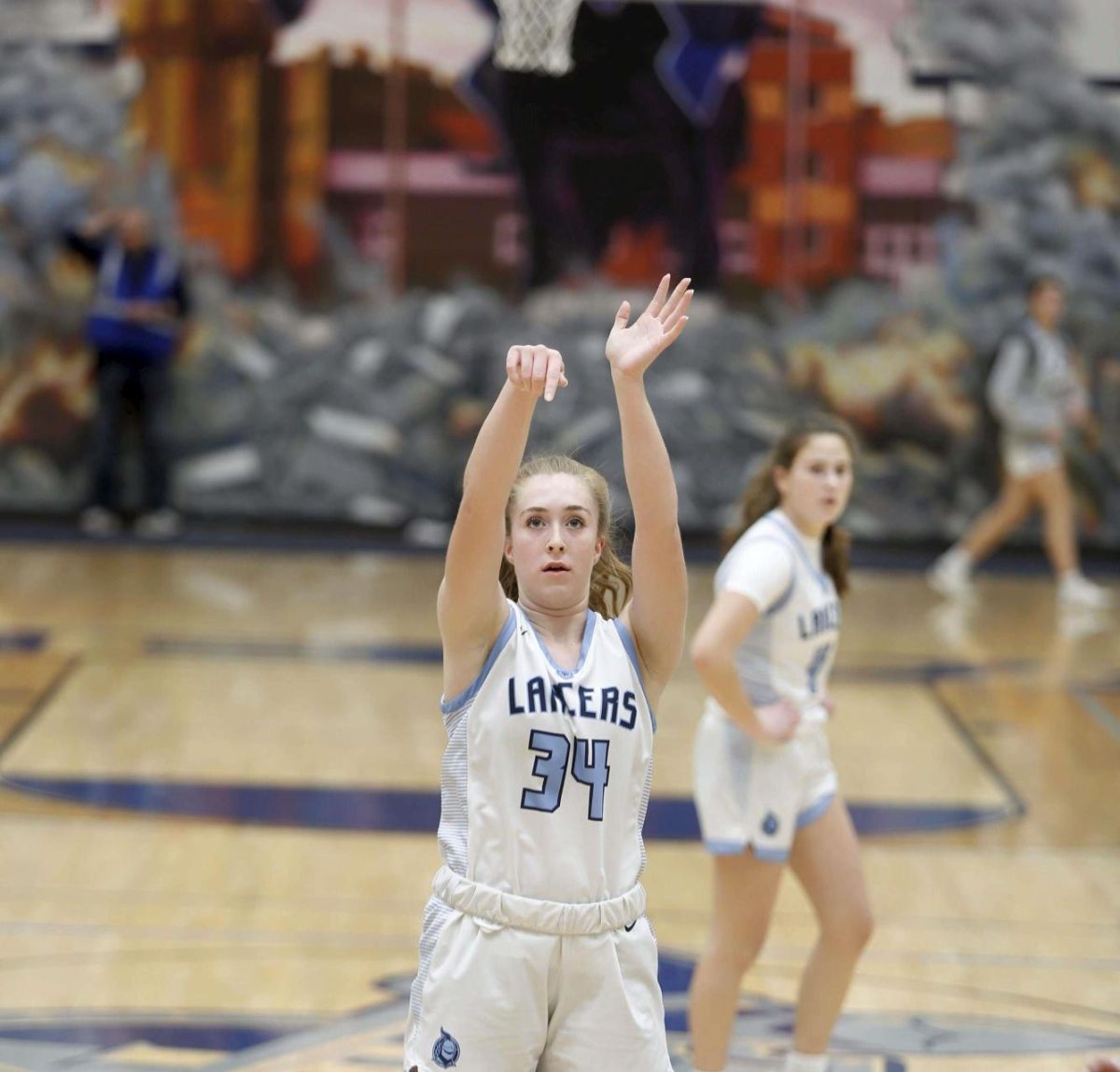 Junior Alex Kiefer shoots a free throw last year in a conference contest against St. Charles East while fellow junior Maggie Frank looks on.