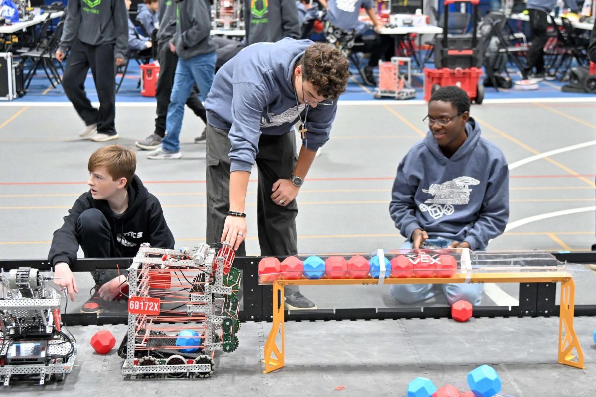 Luciano Ramos (center, LP ‘27) and David Adenekan (Bolingbrook HS, ‘27) compete in a VEX robotics game.
Photo Courtesy: Ms. Sherri Anderson

